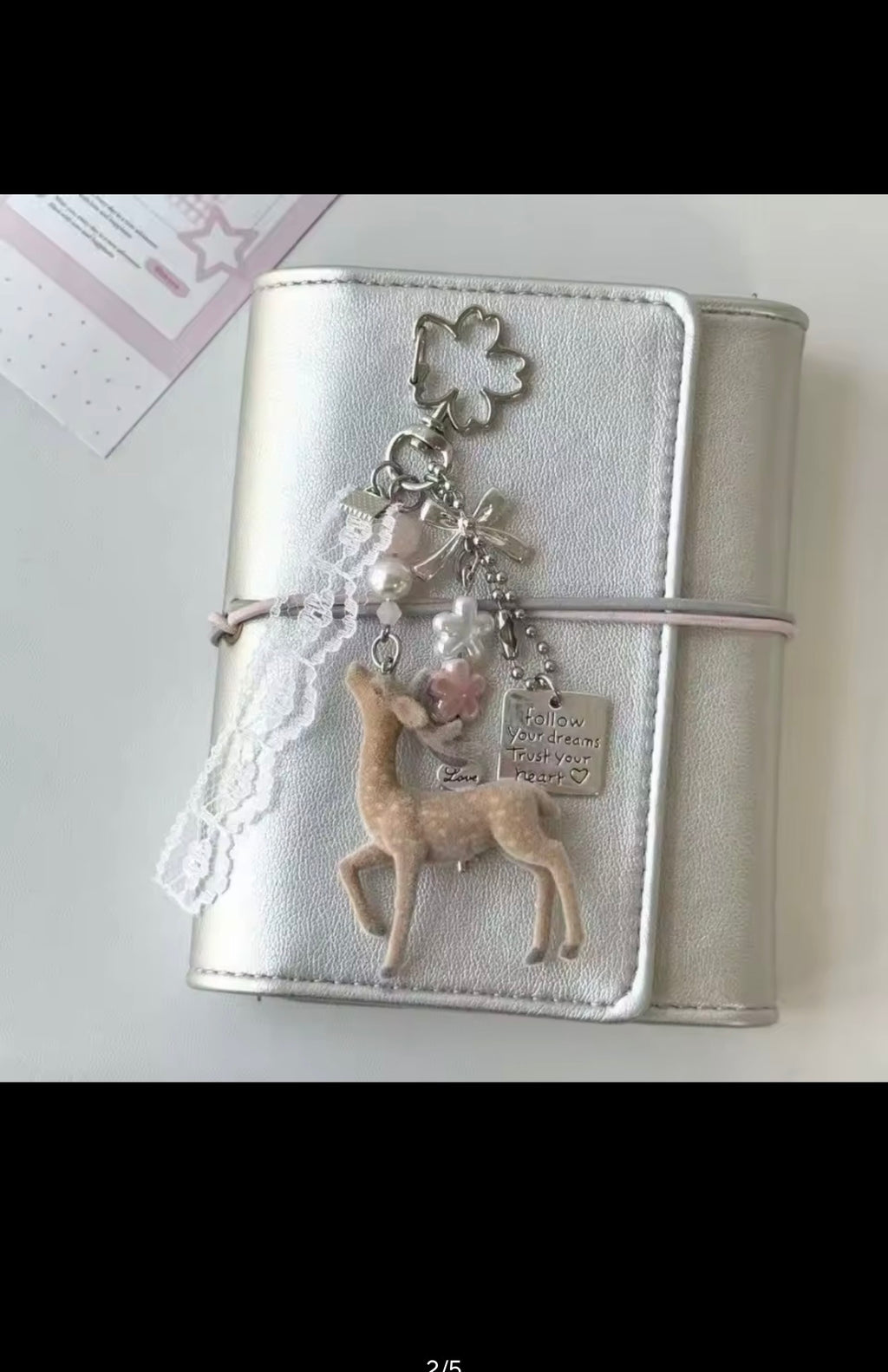 Deer charm attached to a journal