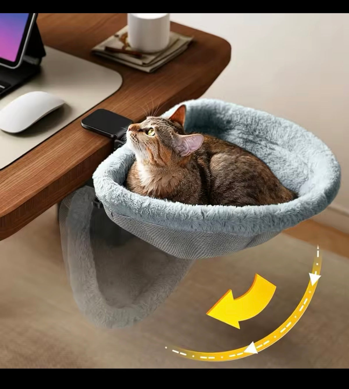 Foldable cat desk bed shown folding down when not in use