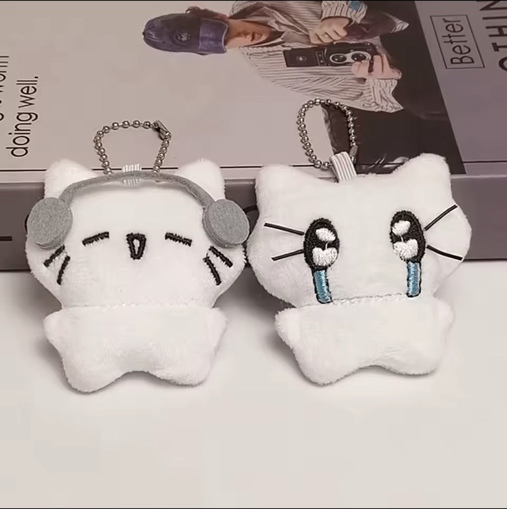Two white plush kitten keychains displayed together