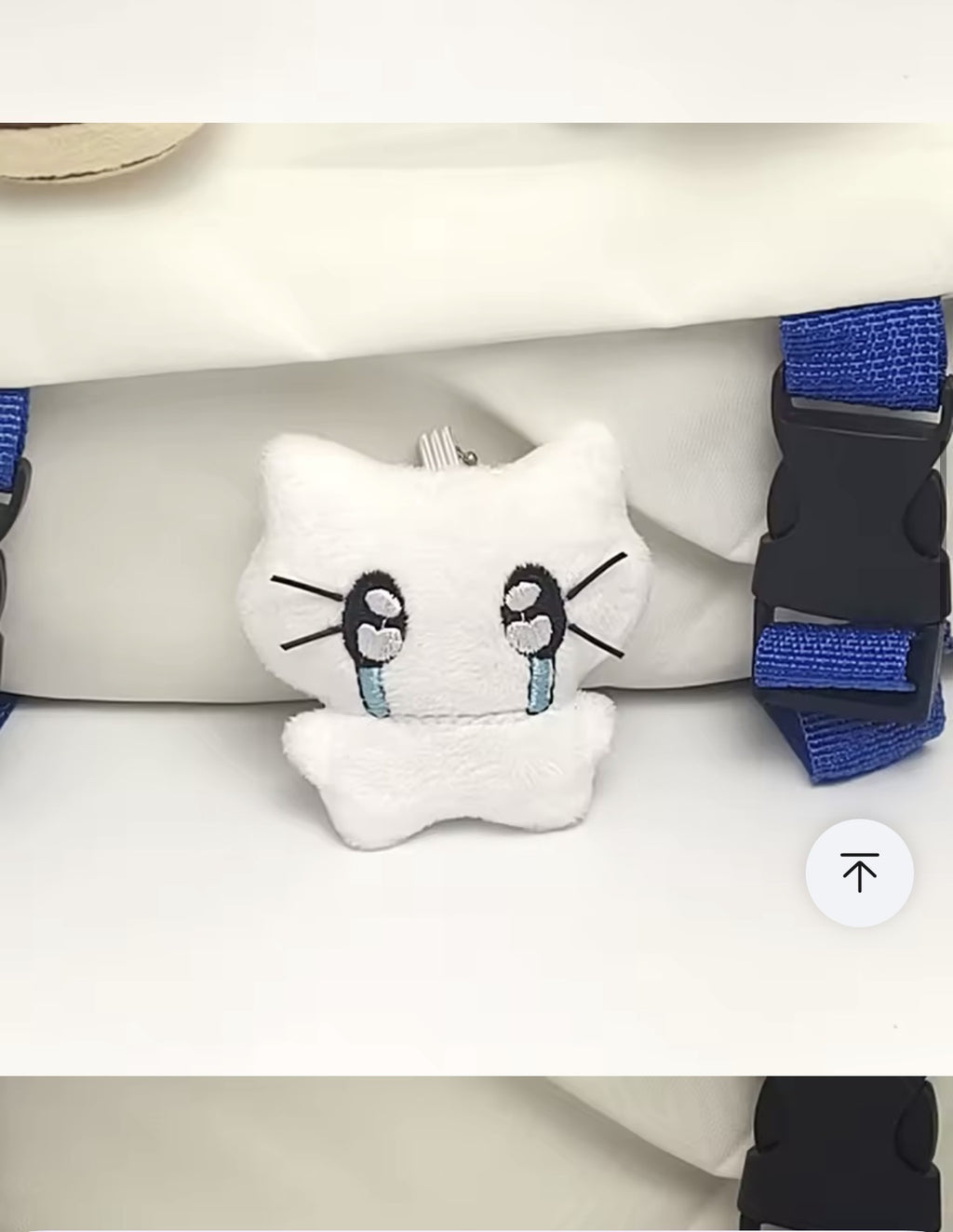 White plush kitten keychain with large embroidered eyes