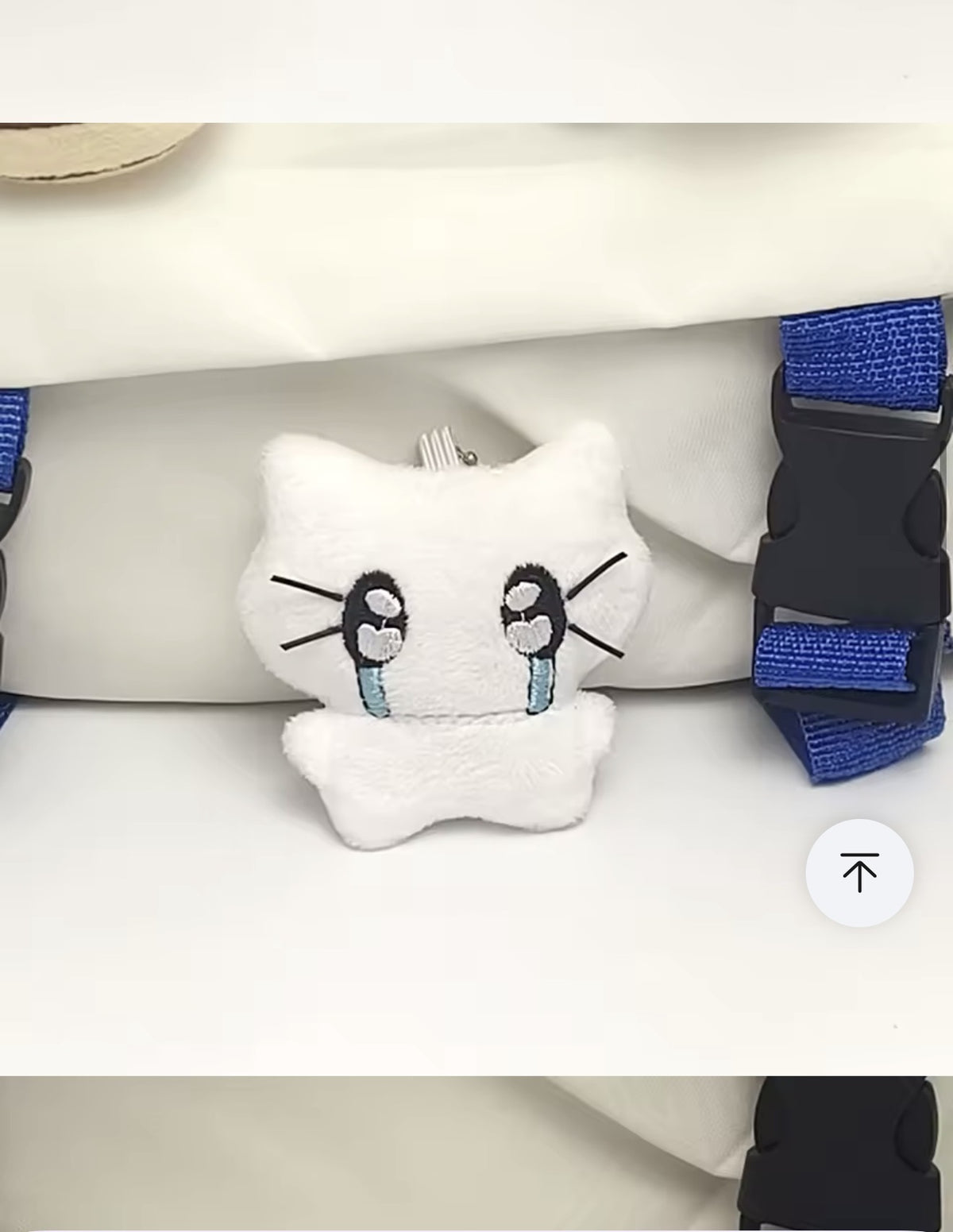 White plush kitten keychain with large embroidered eyes
