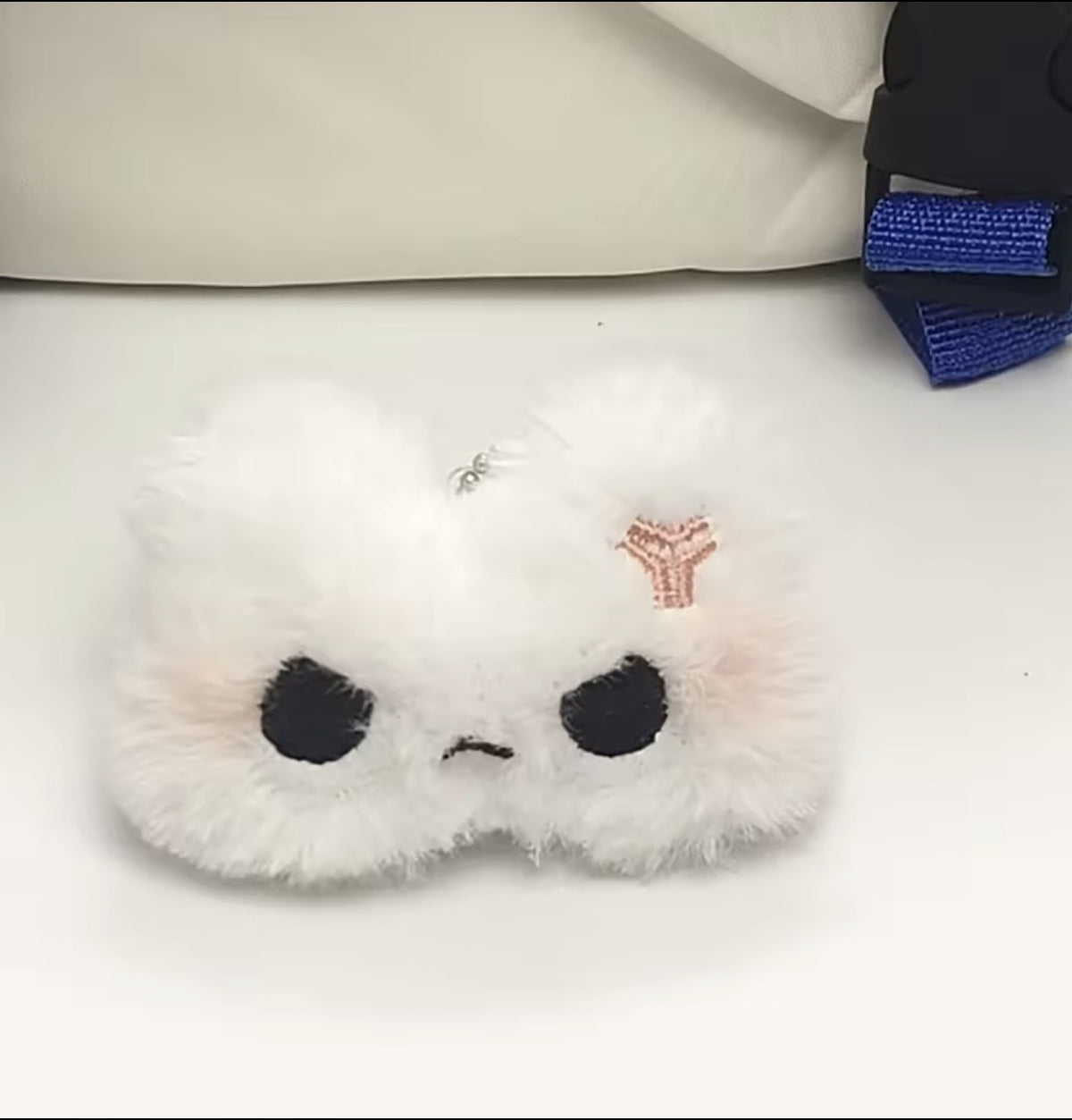 Fluffy white kitten keychain design