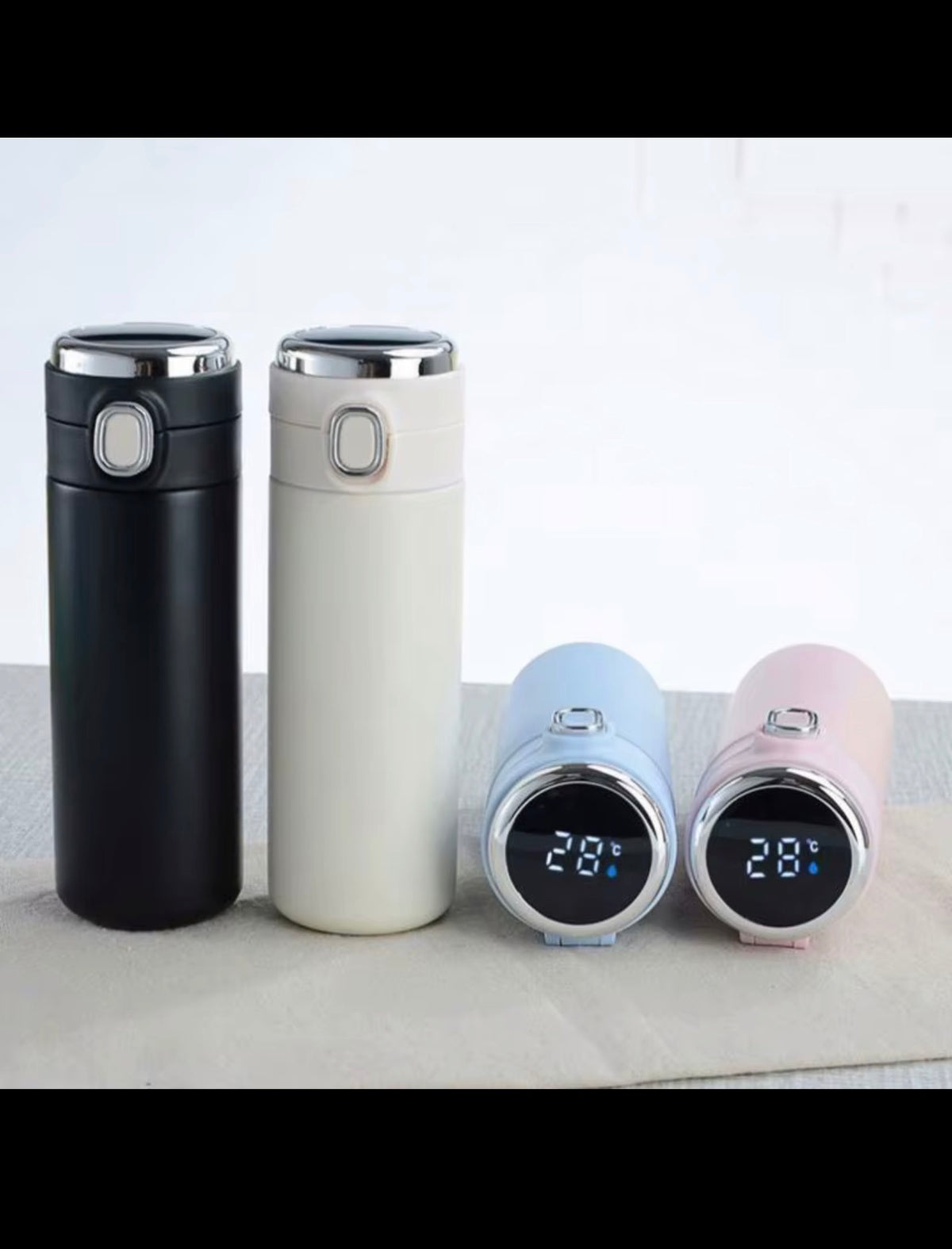 Smart temperature bottle colour options in black white blue and pink